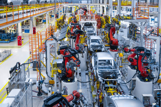 Automotive production line. Welding car body. Modern car Assembly plant Assembly line production of new car. Automated welding of car body on production line. robotic arm on car production line is working Heavy Duty Truck Parts stock pictures, royalty-free photos & images